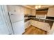 Efficient kitchen with white appliances, ample counter space, and seamless connection to adjacent living areas at 4851 W Gandy Blvd # B11L35, Tampa, FL 33611