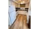 Functional kitchen with white cabinetry, modern appliances, and ample counter space, designed for easy meal preparation at 4851 W Gandy Blvd # B11L35, Tampa, FL 33611