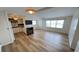 Spacious living room with wood floors, a fireplace, and an open view to the kitchen for easy entertaining at 4851 W Gandy Blvd # B11L35, Tampa, FL 33611