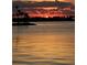 Stunning sunset over the calm waters with palm trees in the foreground at 4851 W Gandy Blvd # B11L35, Tampa, FL 33611