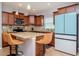 Island kitchen with granite countertops, stainless steel appliances, and light wood cabinets at 1307 Pasadena Bloom Ln, Ruskin, FL 33570