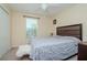 Bright bedroom featuring a plush bed and a cozy atmosphere at 1307 Pasadena Bloom Ln, Ruskin, FL 33570
