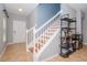 Elegant staircase with a built-in shelving unit at 1307 Pasadena Bloom Ln, Ruskin, FL 33570