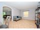Living room with gray couch and view into dining area at 1307 Pasadena Bloom Ln, Ruskin, FL 33570