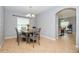 Bright dining room featuring a table with four chairs and a bench at 1307 Pasadena Bloom Ln, Ruskin, FL 33570
