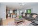 Open living room with kitchen view and comfortable seating at 1307 Pasadena Bloom Ln, Ruskin, FL 33570
