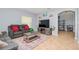 Spacious living room with sectional sofa and fireplace at 1307 Pasadena Bloom Ln, Ruskin, FL 33570