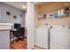Convenient laundry room with washer, dryer, and storage shelves at 1307 Pasadena Bloom Ln, Ruskin, FL 33570