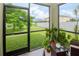 Relaxing screened porch with backyard and garden views at 1307 Pasadena Bloom Ln, Ruskin, FL 33570