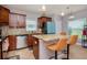 Modern kitchen with island, granite countertops, and stainless steel appliances at 1307 Pasadena Bloom Ln, Ruskin, FL 33570
