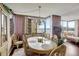 Elegant dining room with a large table and bay window view at 660 Island Way # 506, Clearwater Beach, FL 33767