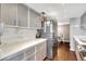 Modern kitchen with stainless steel appliances and white quartz countertops at 660 Island Way # 506, Clearwater Beach, FL 33767