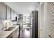 Modern kitchen with stainless steel appliances and quartz countertops at 660 Island Way # 506, Clearwater Beach, FL 33767