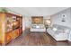 Bright living room with hardwood floors, comfy sofas, and built-in shelving at 660 Island Way # 506, Clearwater Beach, FL 33767