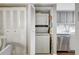 Convenient laundry closet with stackable washer and dryer at 660 Island Way # 506, Clearwater Beach, FL 33767
