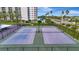 Two well-maintained tennis courts with surrounding fence at 660 Island Way # 506, Clearwater Beach, FL 33767