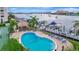 Resort-style pool with waterfront views and lounge chairs at 660 Island Way # 506, Clearwater Beach, FL 33767