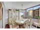 Bright dining area with large windows and a beautiful chandelier at 660 Island Way # 506, Clearwater Beach, FL 33767