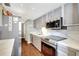 Modern kitchen with stainless steel appliances and quartz countertops at 660 Island Way # 506, Clearwater Beach, FL 33767
