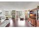 Open living space with hardwood floors, fireplace, and dining area at 660 Island Way # 506, Clearwater Beach, FL 33767