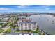 High-rise condo building and waterfront aerial view at 660 Island Way # 506, Clearwater Beach, FL 33767