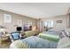 Guest bedroom featuring two twin beds and a convenient workspace at 660 Island Way # 506, Clearwater Beach, FL 33767