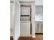 Convenient laundry closet with stackable washer and dryer at 660 Island Way # 506, Clearwater Beach, FL 33767