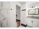 Modern bathroom with marble tile and granite vanity at 2111 Burlington N Ave, St Petersburg, FL 33713