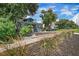 Light blue house with lush landscaping and a spacious front yard at 2111 Burlington N Ave, St Petersburg, FL 33713