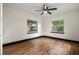 Bright bedroom with hardwood floors and two windows at 2111 Burlington N Ave, St Petersburg, FL 33713