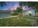 Large backyard with grassy lawn and fire pit at 2111 Burlington N Ave, St Petersburg, FL 33713