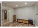 Inviting entryway with stylish storage bench, providing a practical and welcoming space at 12318 Woodleigh Ave, Tampa, FL 33612