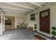 Welcoming covered front porch area with a charming front door and room to sit and relax at 12318 Woodleigh Ave, Tampa, FL 33612