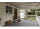 Inviting covered porch with a decorated front door and space for seating or decorations at 12318 Woodleigh Ave, Tampa, FL 33612