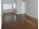 Bright living room with wood-look flooring and a view into the kitchen at 3206 W Azeele St # 225, Tampa, FL 33609