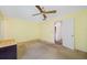 Bedroom featuring neutral colored walls and a doorway to the bathroom at 5521 80Th N St # 310, St Petersburg, FL 33709