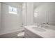 Bathroom with a window over the tub-shower, white subway tile, and a modern vanity with chrome faucet at 6218 Hidden Branch, Apollo Beach, FL 33572
