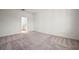 Spacious bedroom with carpeted flooring, ample natural light, and ensuite bathroom access at 6218 Hidden Branch, Apollo Beach, FL 33572