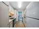 Condo kitchen with white cabinets and appliances at 5521 80Th N St # 310, St Petersburg, FL 33709