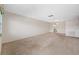 Open living room showcasing carpeted floors and access to other areas at 5521 80Th N St # 310, St Petersburg, FL 33709