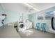 Clean laundry room with multiple washing machines and dryers at 5521 80Th N St # 310, St Petersburg, FL 33709