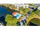 Community pool with a covered patio area at 5521 80Th N St # 310, St Petersburg, FL 33709