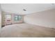 Spacious condo living room with neutral carpeting at 5521 80Th N St # 310, St Petersburg, FL 33709