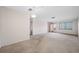 Spacious living room with carpeted floors and ample natural light at 5521 80Th N St # 310, St Petersburg, FL 33709