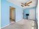 Bedroom with light blue walls and window at 5521 80Th N St # 310, St Petersburg, FL 33709