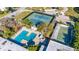 Aerial view of community with pool, tennis court and shuffleboard at 5521 80Th N St # 310, St Petersburg, FL 33709