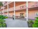 Condominium building entrance with walkway and landscaping at 5521 80Th N St # 310, St Petersburg, FL 33709