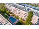 Aerial view of building with pool and surrounding landscape at 5521 80Th N St # 310, St Petersburg, FL 33709