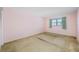 Simple bedroom with neutral walls and carpeting at 5521 80Th N St # 310, St Petersburg, FL 33709