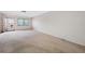 Bright living room featuring carpet flooring and an open layout at 5521 80Th N St # 310, St Petersburg, FL 33709